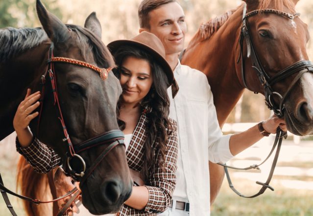 A,Pregnant,Woman,In,A,Hat,And,Her,Husband,In